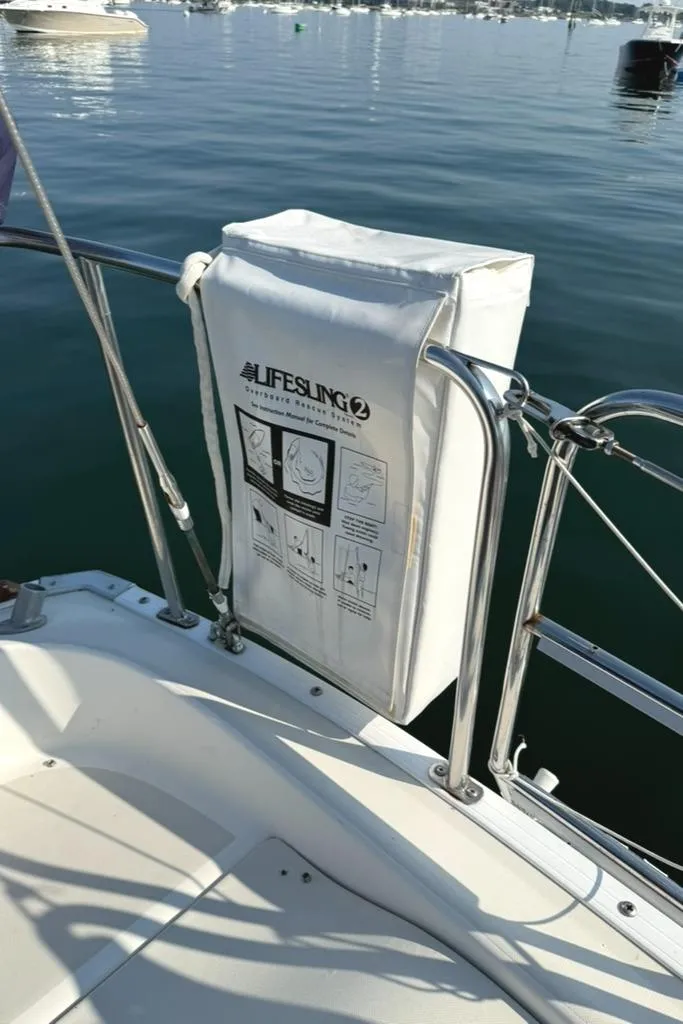 Slide: The Image of Lifesling 2 mounted on 1986 Pearson 33-2 sailboat, calm water background. - 9