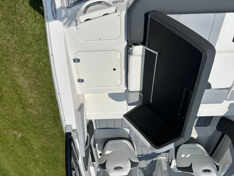 Slide: The Image of 2025 Chaparral 21 SSi boat interior with gray and white seating and flooring. - 12