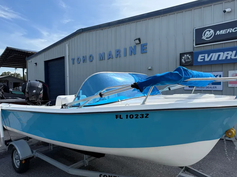 Slide: The Image of 1963 T Craft VHULL boat in blue at Toho Marine dealership. - 2