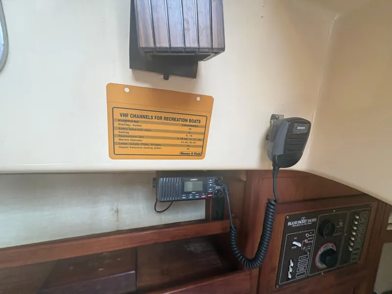 Slide: The Image of VHF radio setup on 1986 Island Packet IP27 Cutter sailboat interior. - 28