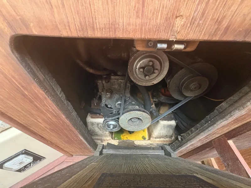 Slide: The Image of Engine compartment of a 1986 Island Packet IP27 Cutter sailboat, showing belts and pulleys. - 31