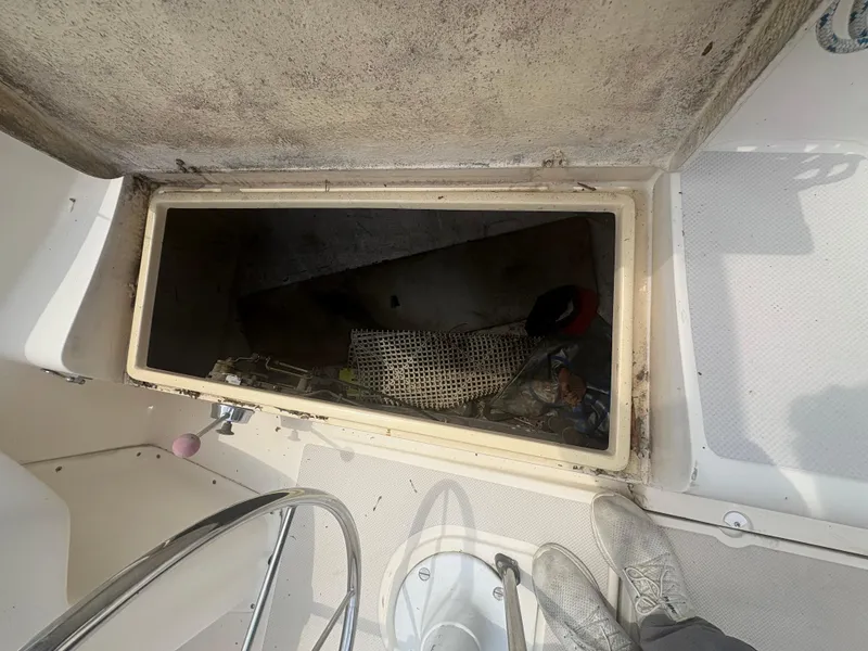 Slide: The Image of Open storage compartment on 1986 Island Packet IP27 Cutter sailboat deck. - 9