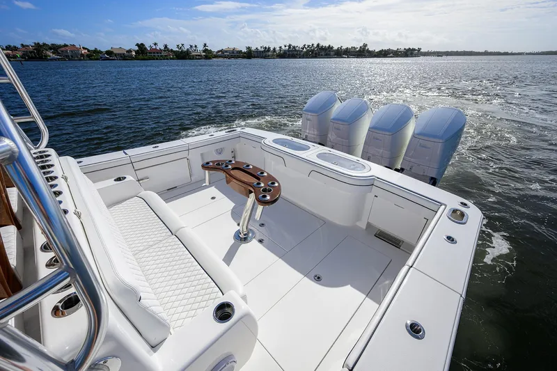 Slide: The Image of 2026 Valhalla Boatworks V-46 with quad engines on open water, featuring spacious deck. - 14