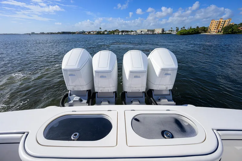 Slide: The Image of 2026 Valhalla Boatworks V-46 with four powerful outboard engines on open water. - 20