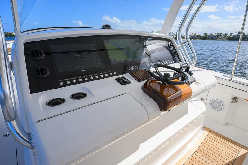 Slide: The Image of 2026 Valhalla Boatworks V-46 helm with advanced navigation displays and steering wheel. - 4