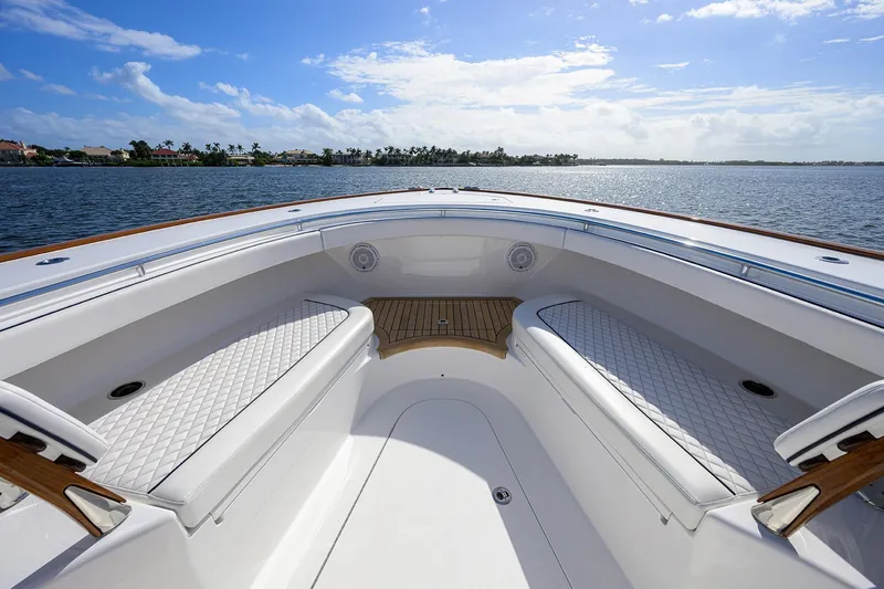 Slide: The Image of 2026 Valhalla Boatworks V-46 interior, featuring luxurious seating and scenic water view. - 8