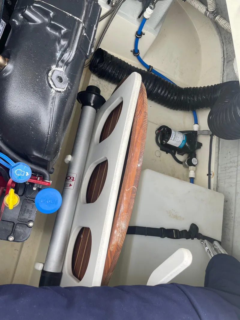 Slide: The Image of Engine compartment of a 2020 Chris-Craft Launch 23 boat, showing mechanical components. - 11