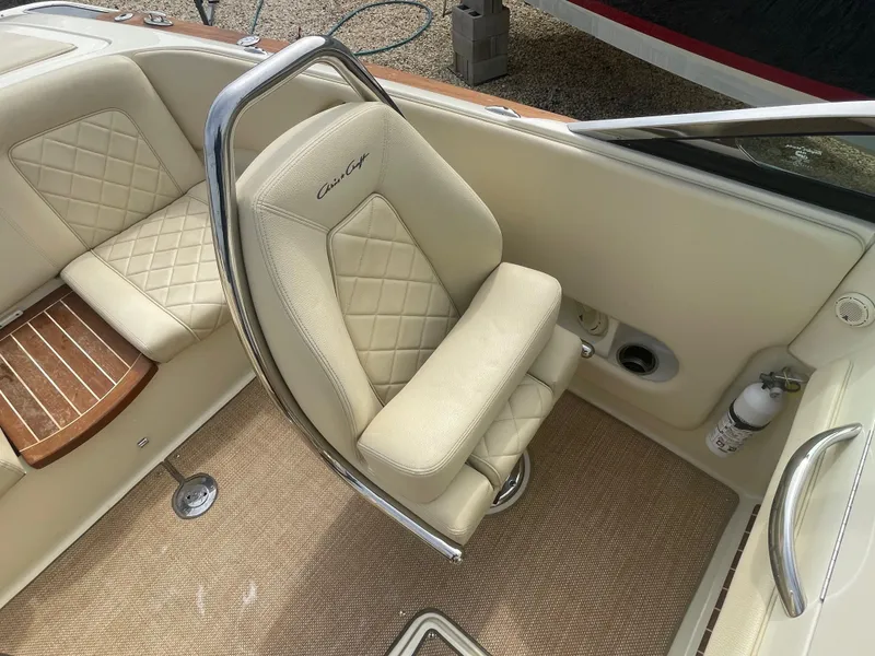 Slide: The Image of 2020 Chris-Craft Launch 23 interior with beige leather seating and elegant design. - 14