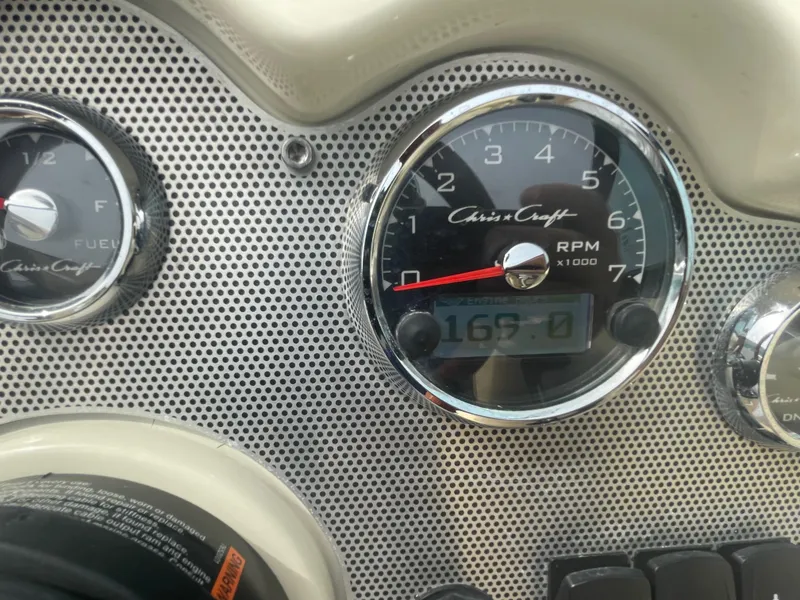 Slide: The Image of Dashboard of 2020 Chris-Craft Launch 23 boat showing RPM and fuel gauges. - 16