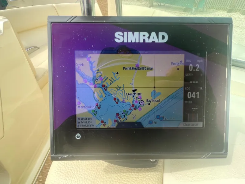 Slide: The Image of Simrad navigation display on 2020 Chris-Craft Launch 23 boat, showing a detailed marine map. - 17