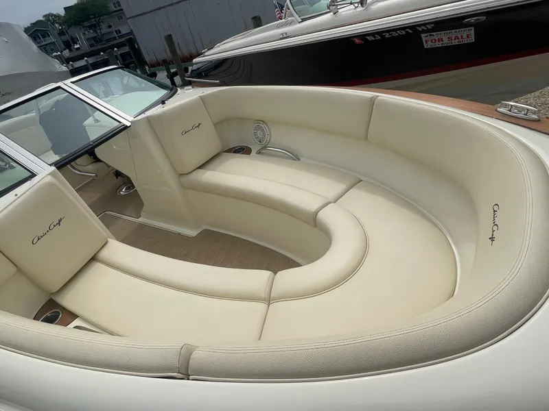 Slide: The Image of 2020 Chris-Craft Launch 23 boat interior with cream leather seating. - 23