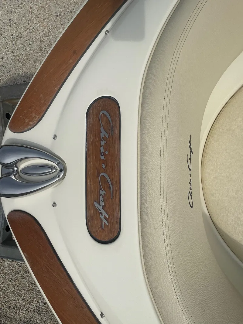 Slide: The Image of 2020 Chris-Craft Launch 23 boat interior with wood and leather details. - 27