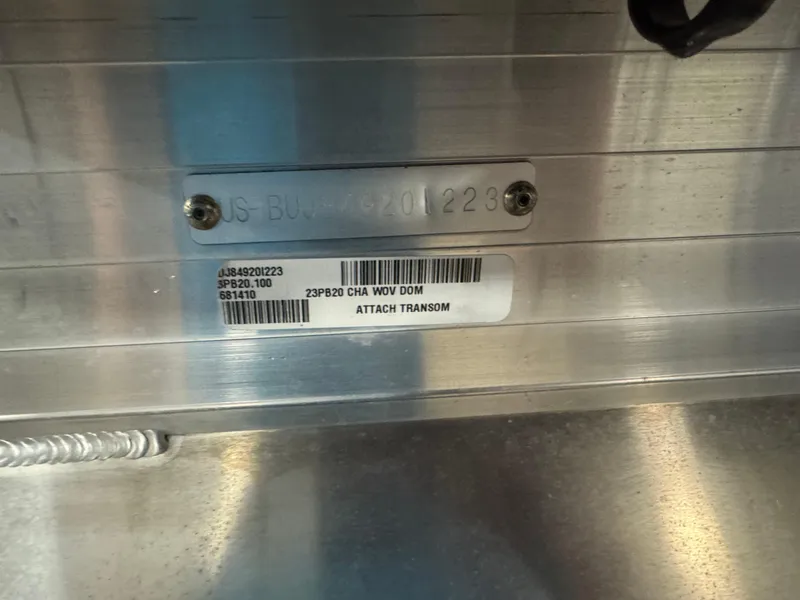 Slide: The Image of 2023 Sun Tracker Party Barge 20 DLX transom identification plate and barcode. - 5