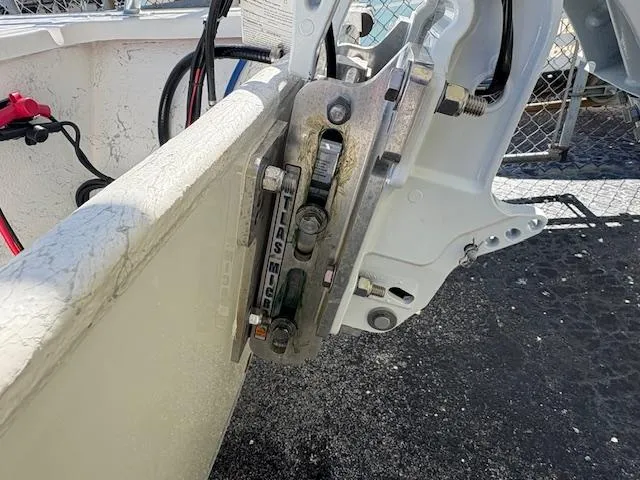 Slide: The Image of 2025 Mitzi Skiff 15 boat motor mount detail with visible hardware and cables. - 6