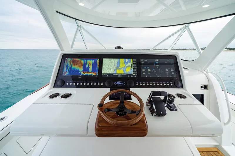 Slide: The Image of 2026 Valhalla Boatworks V-55 helm with advanced navigation displays and controls. - 10