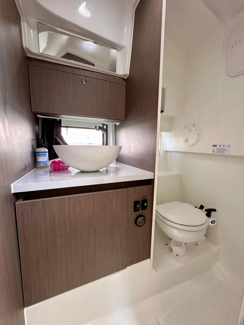 Slide: The Image of 2023 Beneteau Flyer 9 SUNdeck bathroom with modern sink and toilet. - 22