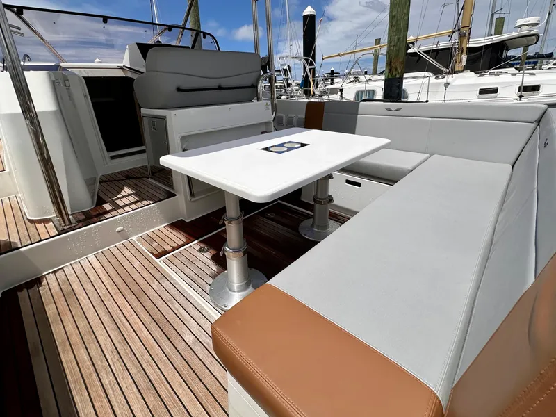 Slide: The Image of 2023 Beneteau Flyer 9 SUNdeck interior with seating and table, showcasing luxury yacht design. - 8