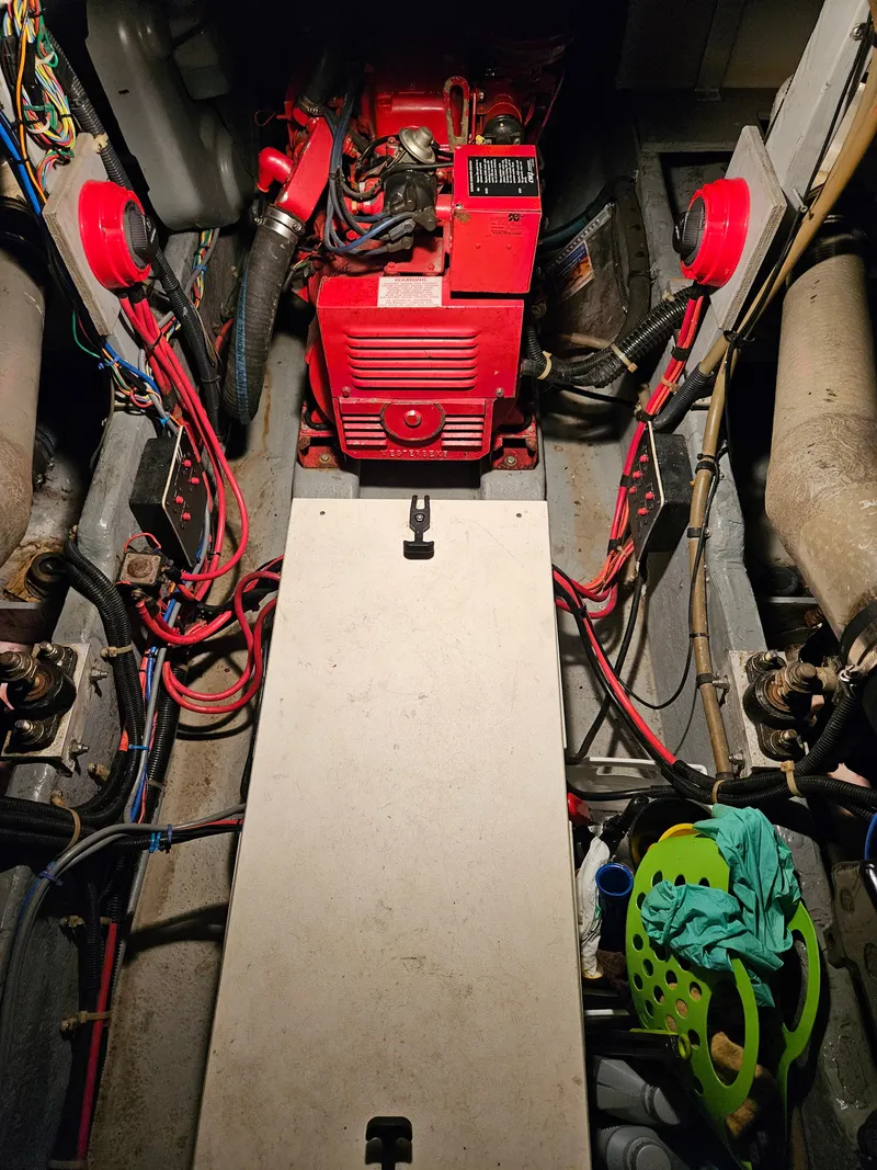 Slide: The Image of Engine room of 1989 Sea Ray 390 Express with visible wiring and components. - 11