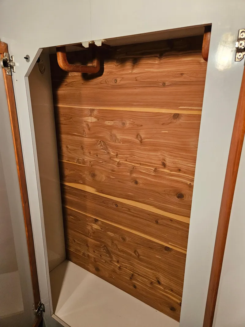 Slide: The Image of Wooden interior paneling of 1989 Sea Ray 390 Express boat. - 24