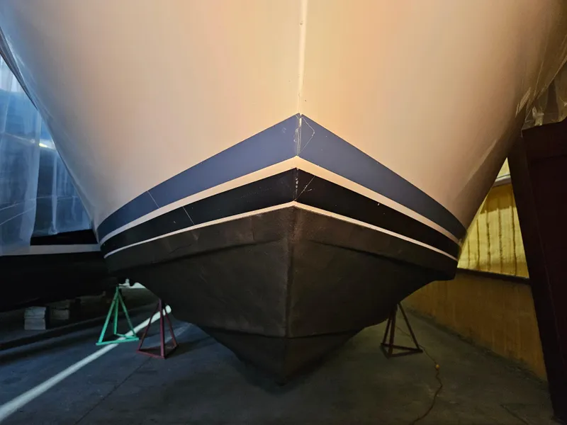 Slide: The Image of 1989 Sea Ray 390 Express boat hull in storage, showcasing sleek design and sturdy construction. - 4