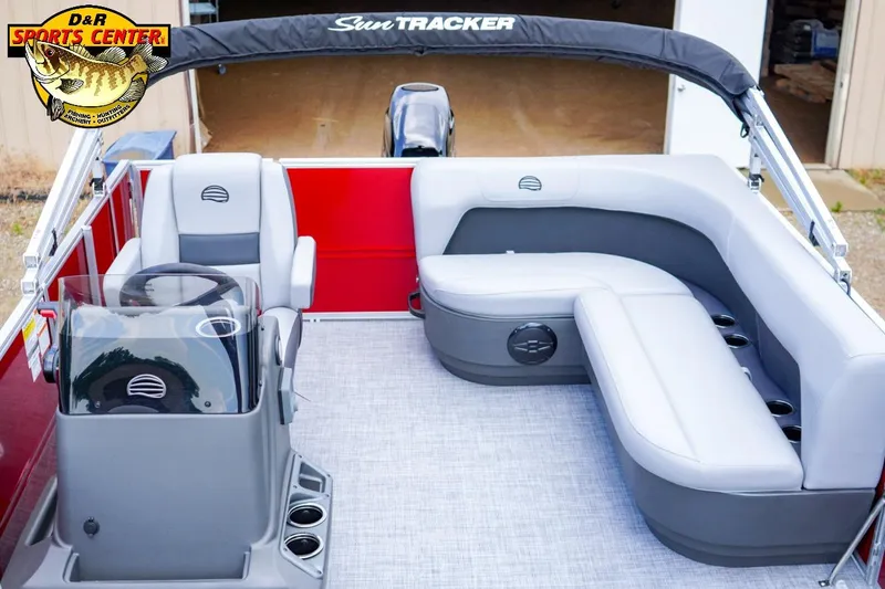 Slide: The Image of 2026 Sun Tracker Party Barge 16 interior with seating and steering console, showcased at D&R Sports Center. - 3