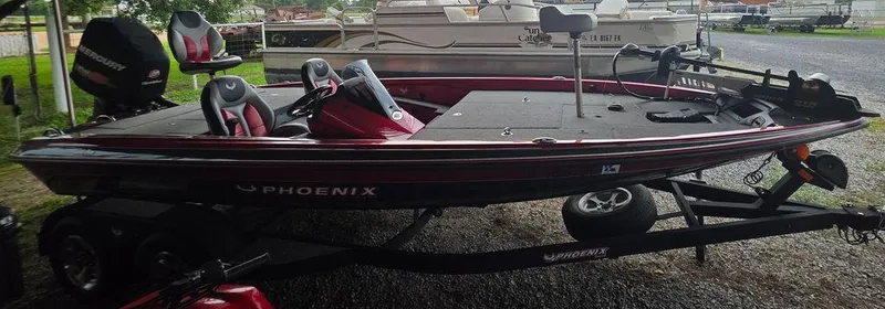 Slide: The Image of 2018 Phoenix 819 Pro boat interior with control panel and foot pedal. - 11