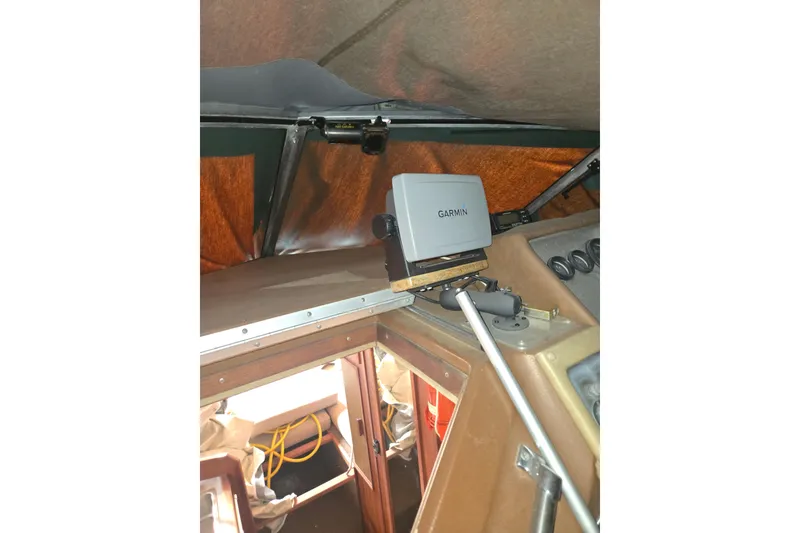 Slide: The Image of 1983 Sea Ray Weekender interior with Garmin navigation system. - 8