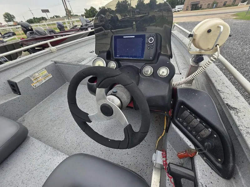 Slide: The Image of Steering console of 2016 Xpress Xclusive Series X18 boat with navigation equipment. - 10