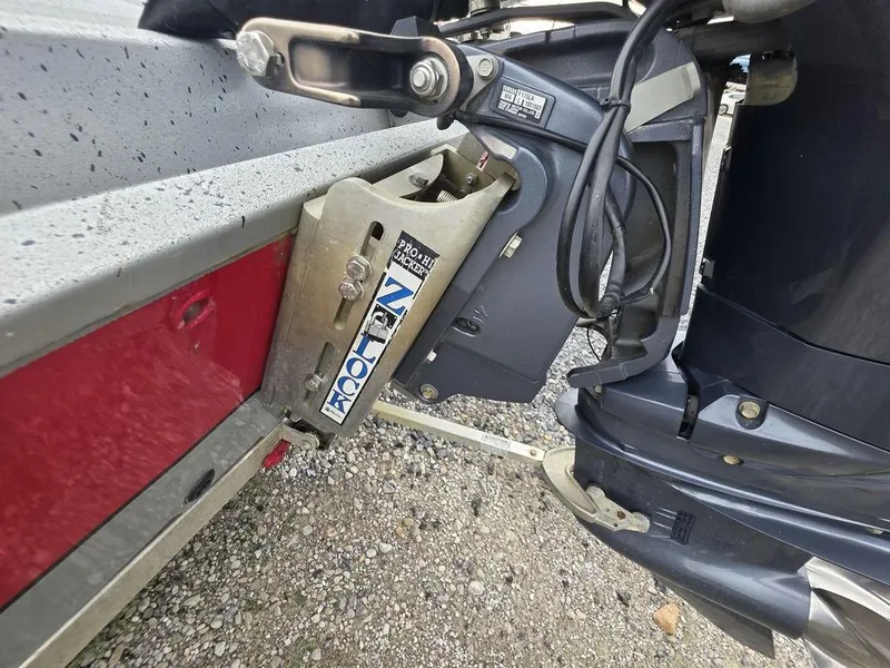 Slide: The Image of Outboard motor mount on 2016 Xpress Xclusive Series X18 boat, featuring Pro Hi-Jacker Z-Lock. - 14