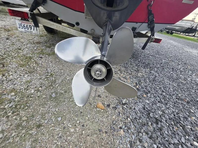Slide: The Image of Propeller of 2016 Xpress Xclusive Series X18 boat on gravel surface. - 15