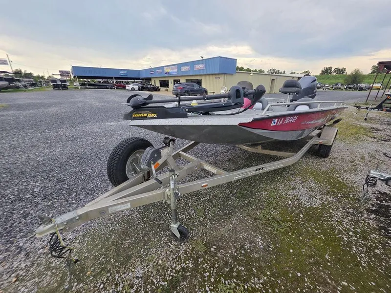 Slide: The Image of 2016 Xpress Xclusive Series X18 boat on trailer in dealership lot. - 5