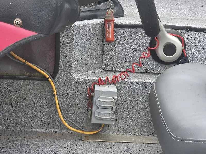 Slide: The Image of Interior of 2016 Xpress Xclusive Series X18 boat showing steering wheel and electrical components. - 9