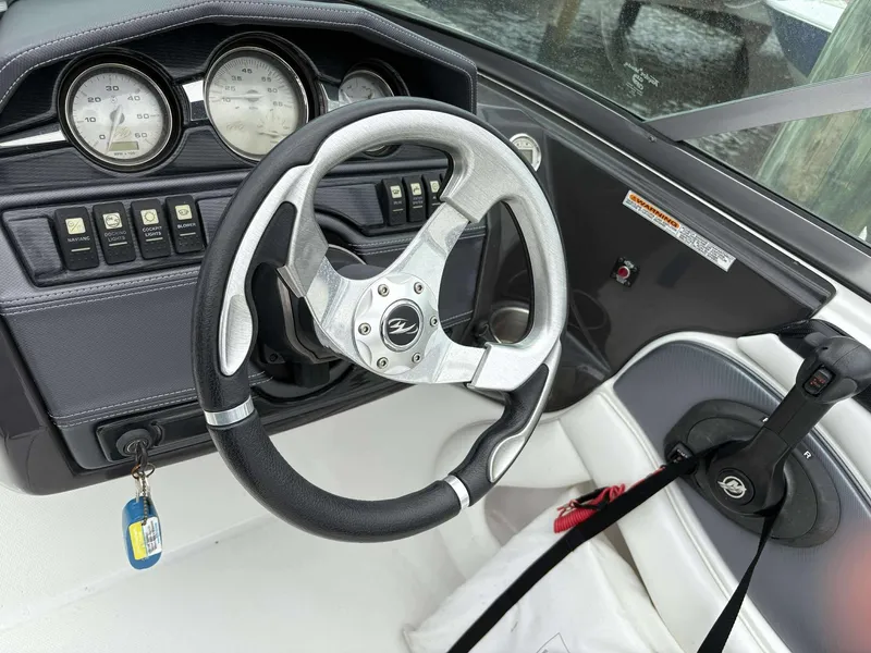 Slide: The Image of Steering wheel and dashboard of a 2015 Monterey 224FS boat. - 9
