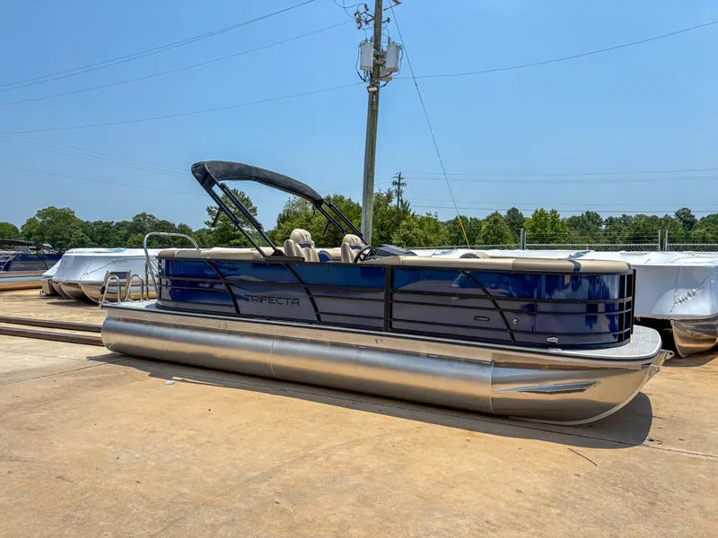 The Image of 2025 Trifecta CS 24RF 3.0 pontoon boat on display outdoors. - 0