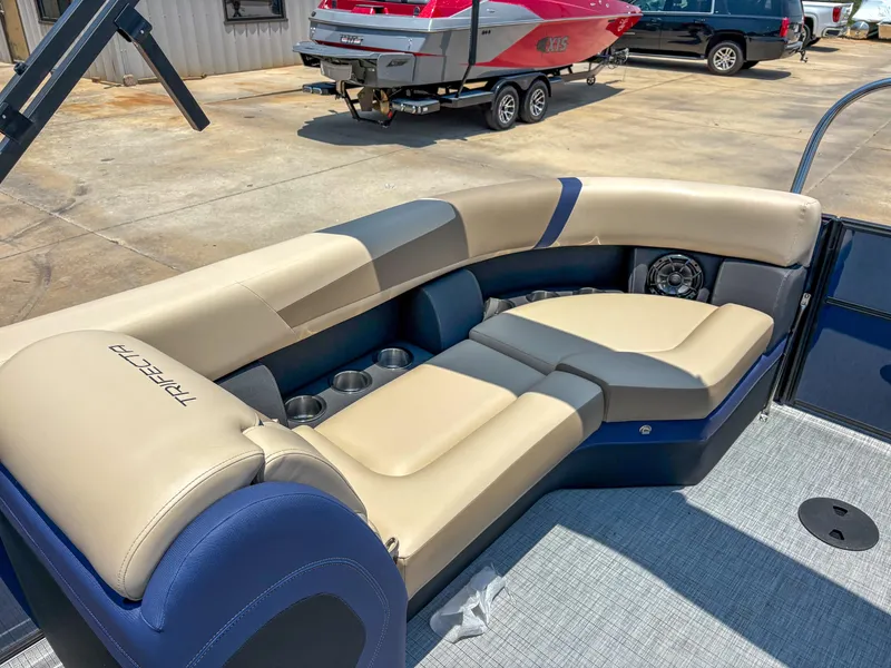 Slide: The Image of Luxurious seating on 2025 Trifecta CS 24RF 3.0 pontoon boat, featuring cup holders and speaker. - 10