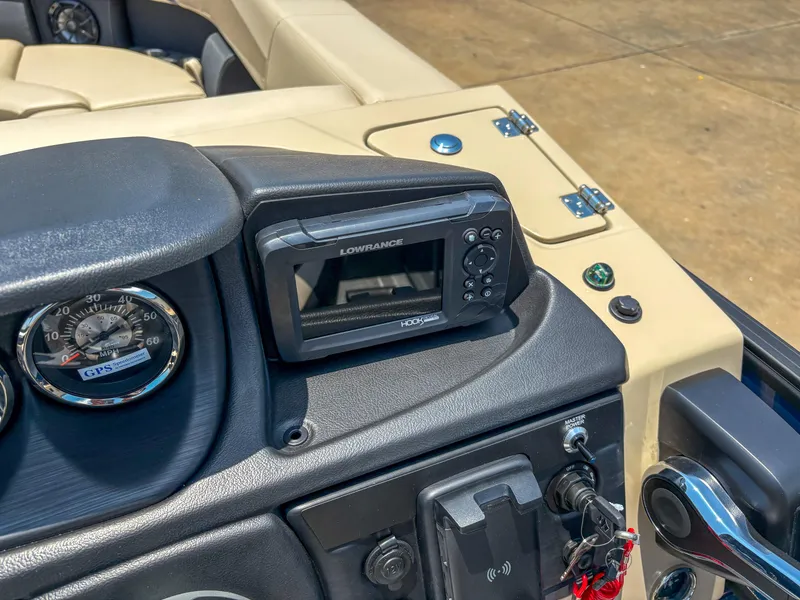 Slide: The Image of Dashboard of 2025 Trifecta CS 24RF 3.0 with Lowrance GPS and speedometer. - 13