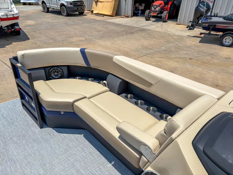 Slide: The Image of Luxurious seating on 2025 Trifecta CS 24RF 3.0 pontoon boat, featuring cup holders and premium upholstery. - 4