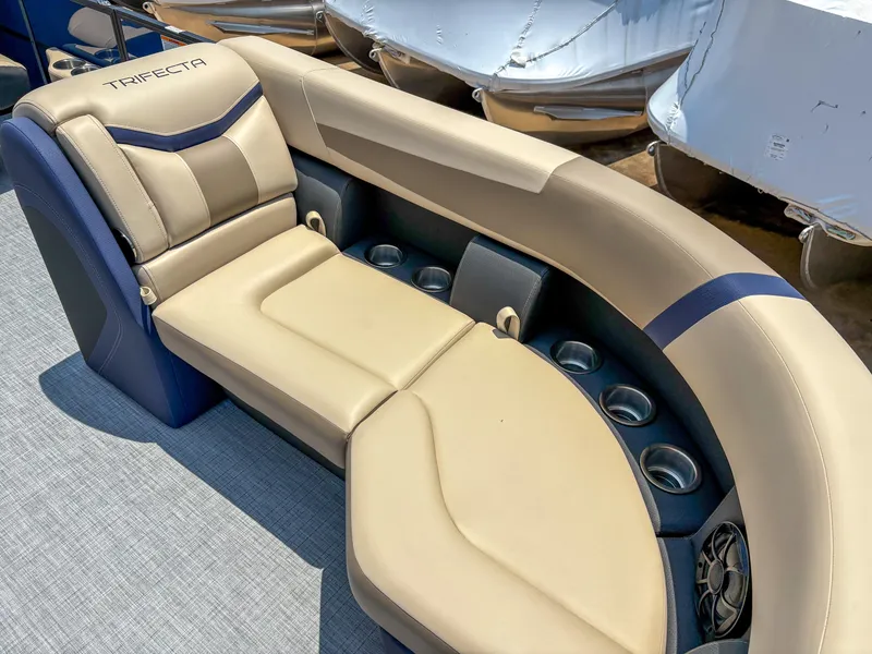 Slide: The Image of Luxurious seating on 2025 Trifecta CS 24RF 3.0 pontoon boat with cup holders. - 6