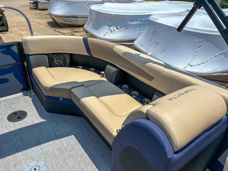Slide: The Image of Luxurious seating on 2025 Trifecta CS 24RF 3.0 pontoon boat, featuring beige upholstery. - 9