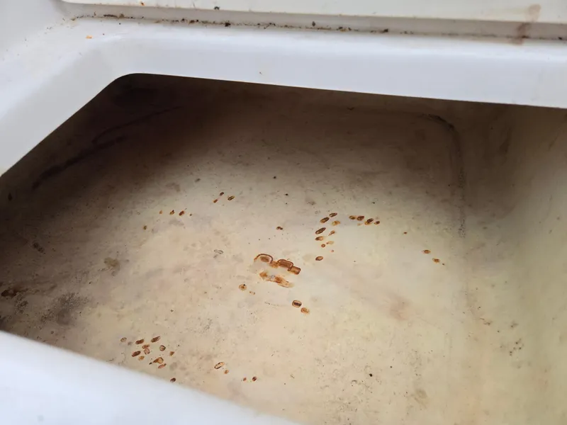 Slide: The Image of 1997 Pro-Line 201 Walkaround storage compartment with rust stains. - 28