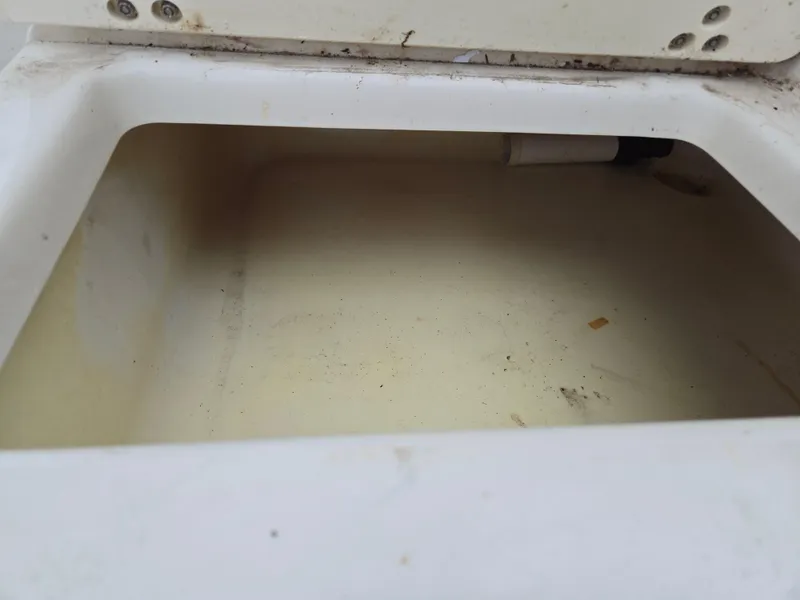 Slide: The Image of 1997 Pro-Line 201 Walkaround storage compartment, white interior, slightly worn. - 31
