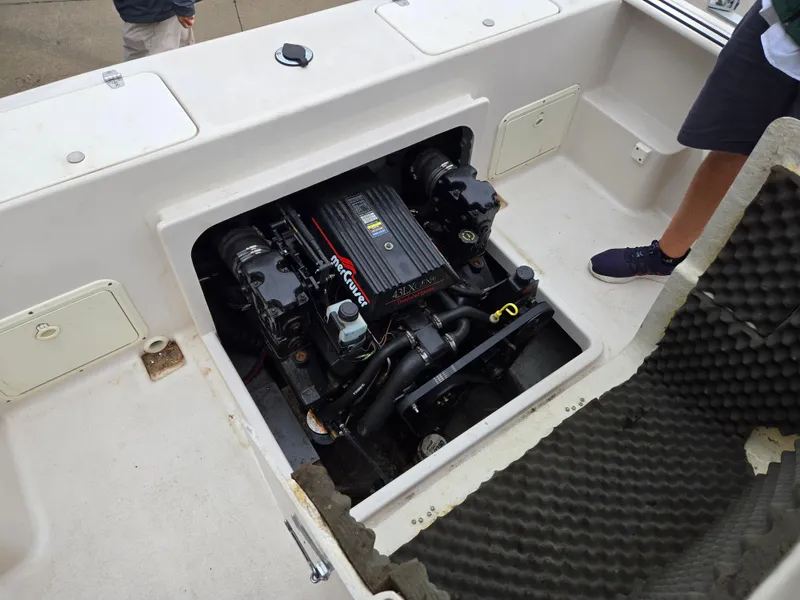 Slide: The Image of 1997 Pro-Line 201 Walkaround boat engine compartment with MerCruiser engine visible. - 33