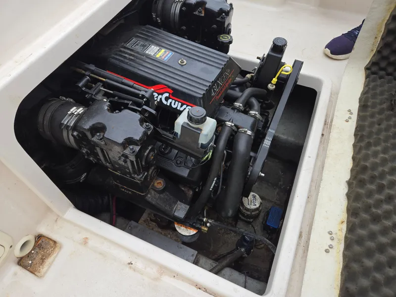 Slide: The Image of 1997 Pro-Line 201 Walkaround boat engine compartment with MerCruiser engine. - 34