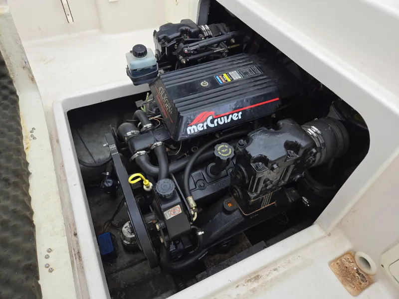 Slide: The Image of 1997 Pro-Line 201 Walkaround boat engine, featuring a MerCruiser motor. - 35