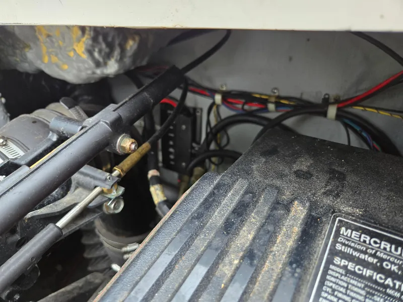 Slide: The Image of Close-up of 1997 Pro-Line 201 Walkaround boat engine components and wiring. - 38