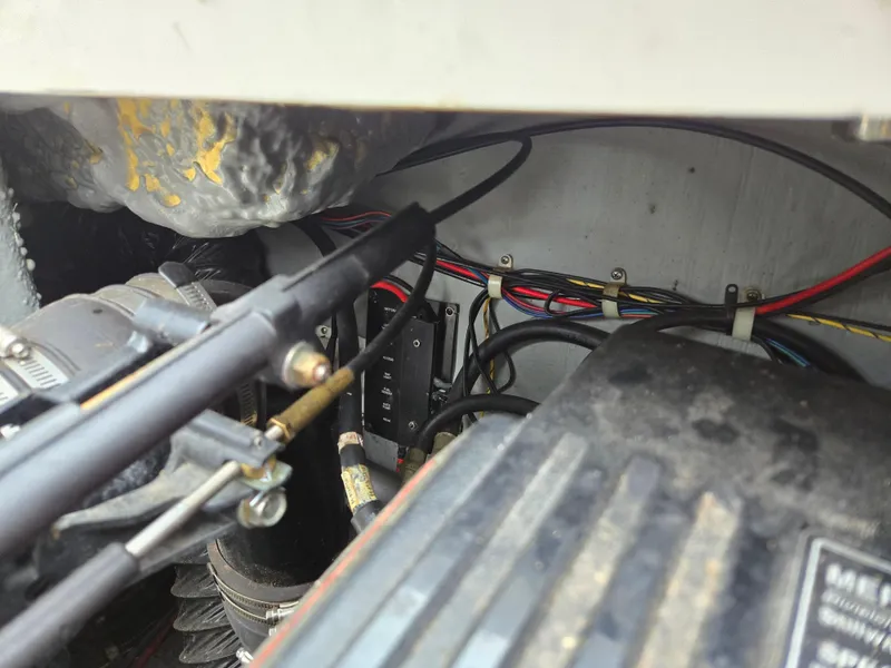 Slide: The Image of Engine compartment of a 1997 Pro-Line 201 Walkaround boat, showing wiring and components. - 39