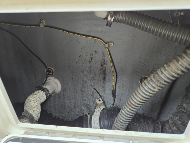 Slide: The Image of Interior wiring and hoses of a 1997 Pro-Line 201 Walkaround boat. - 42