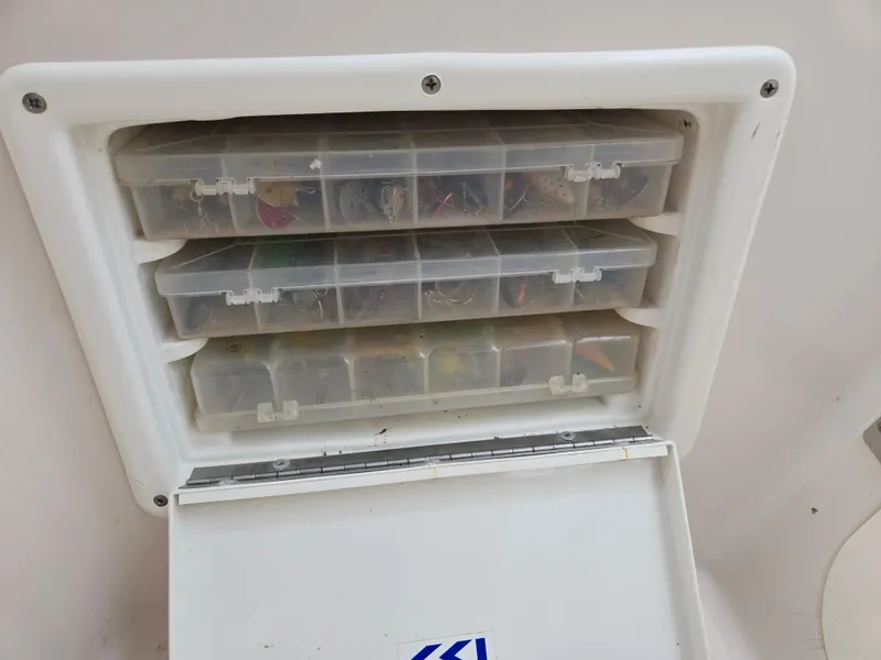 Slide: The Image of Tackle storage compartment on 1997 Pro-Line 201 Walkaround boat. - 44