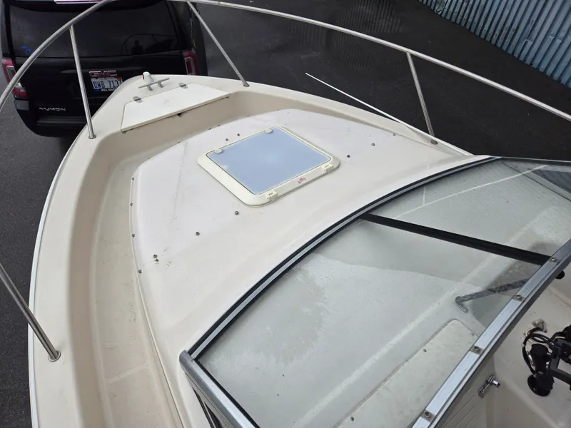 Slide: The Image of 1997 Pro-Line 201 Walkaround boat deck with windshield and hatch. - 45