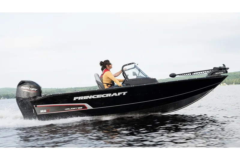 Slide: The Image of Manufacturer Provided Image: 2025 Princecraft Holiday 162 WS MAX boat cruising on a lake. - 2